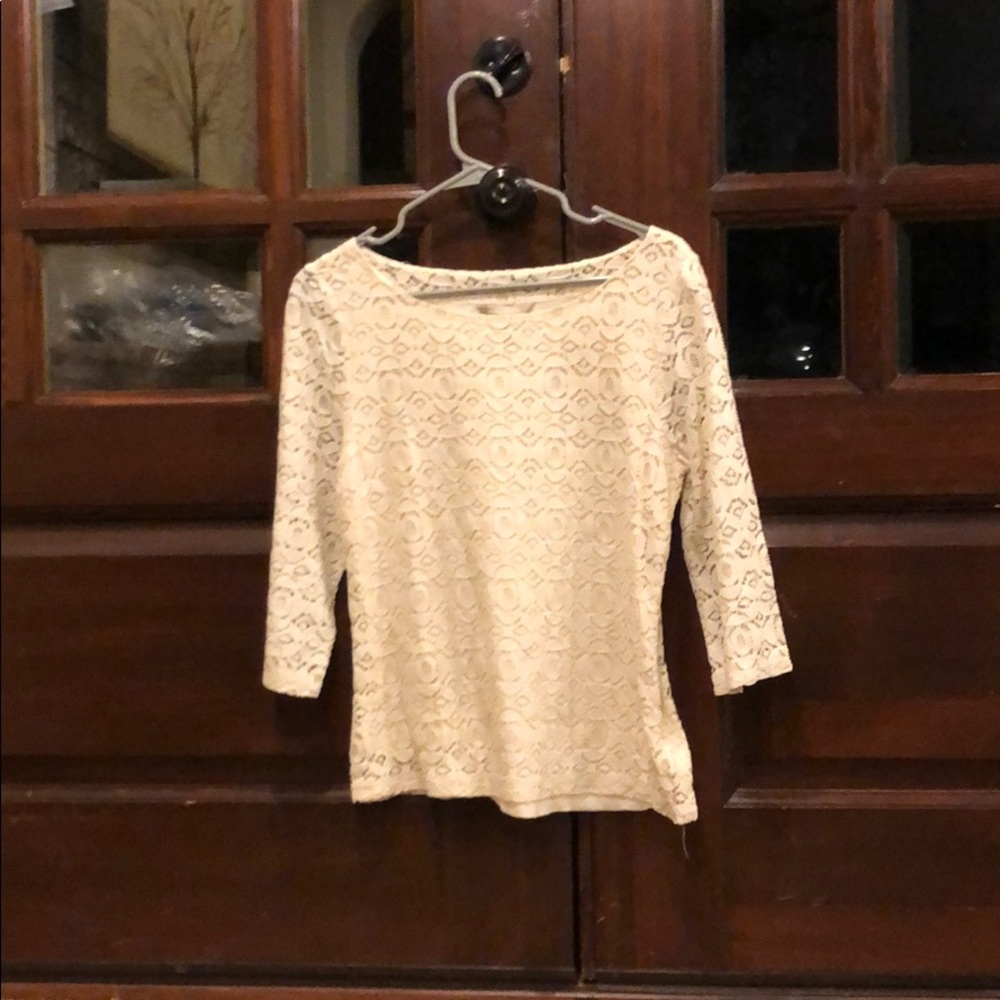 Beige colored long sleeve blouse